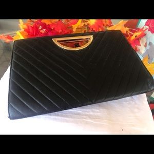 Black Clutch purse. Very chic for party season.